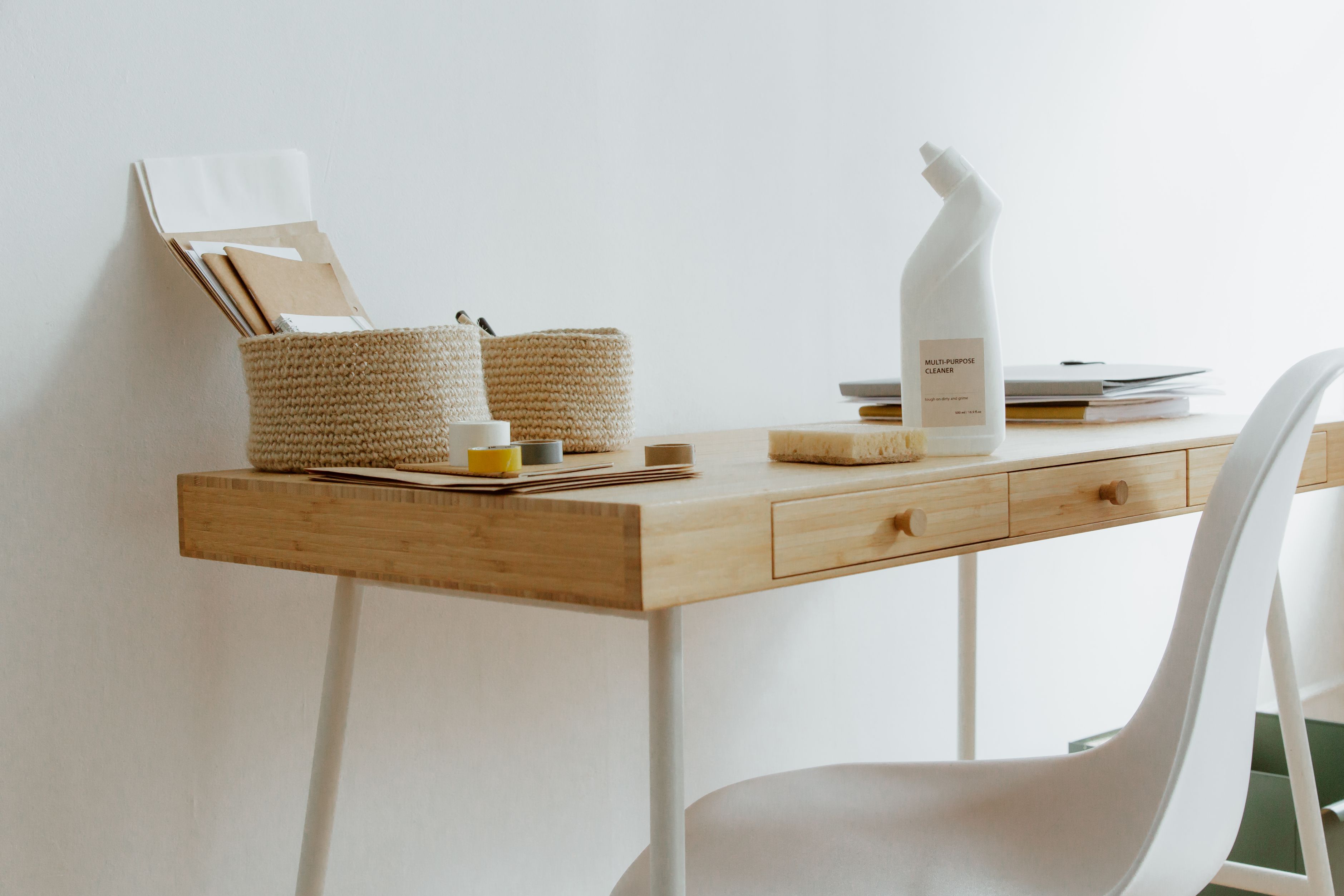 Clean desk with cleaning supplies, ready for a wipe-down