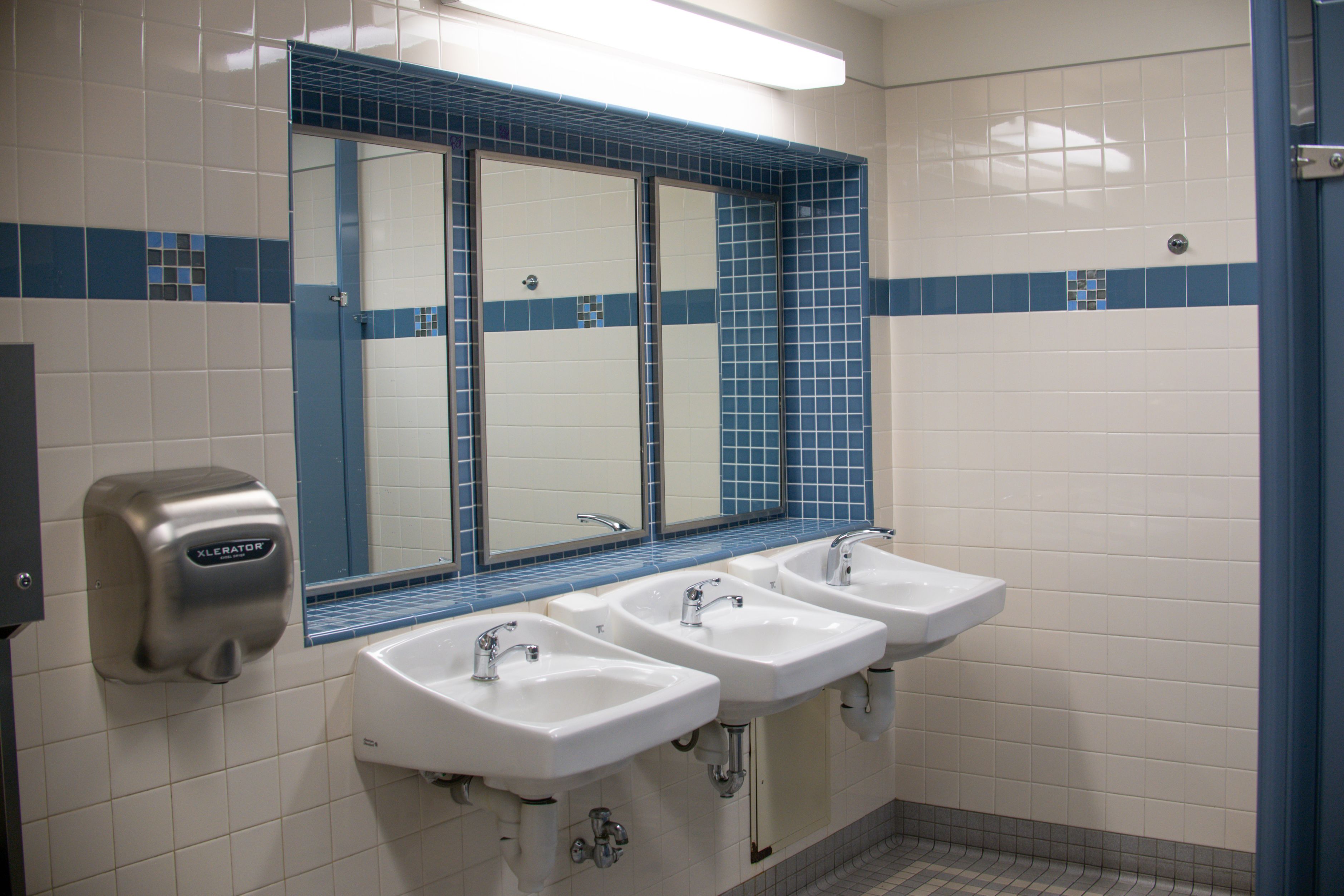 Clean, tiled commercial restroom in a Kennesaw medical clinic